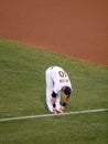 Oakland AÃ¢â¬â¢s Pitcher Daric Barton does at standing forward fold Royalty Free Stock Photo